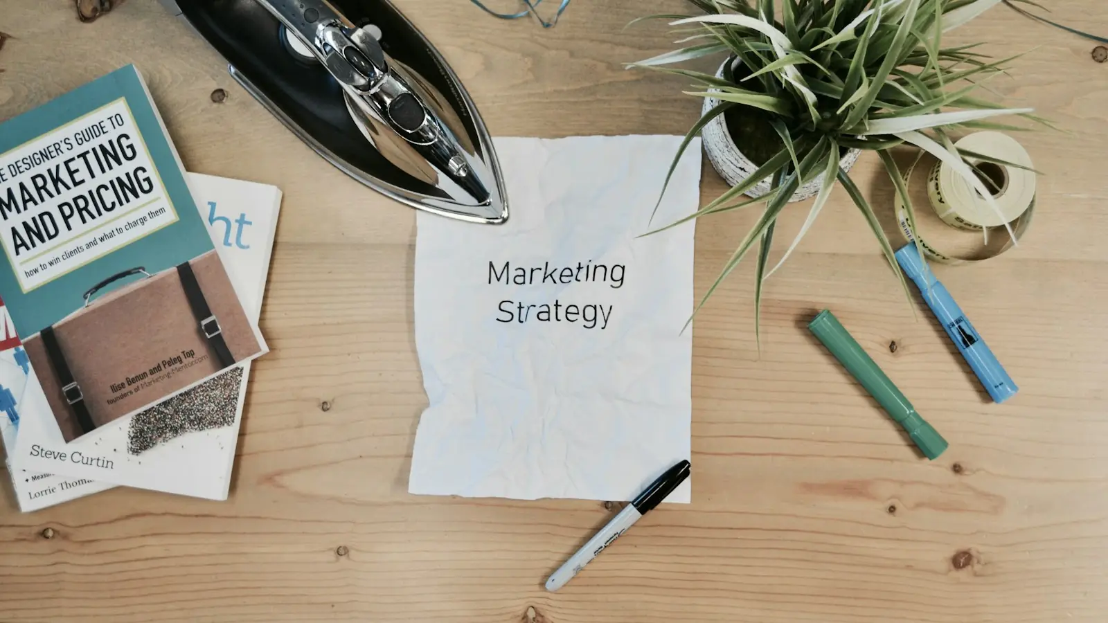 Marketing strategy notes and books on a desk