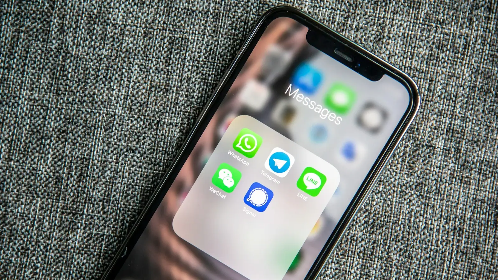 Smartphone showing a folder of messaging apps
