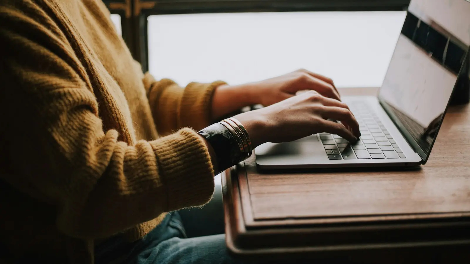 Person typing on a laptop