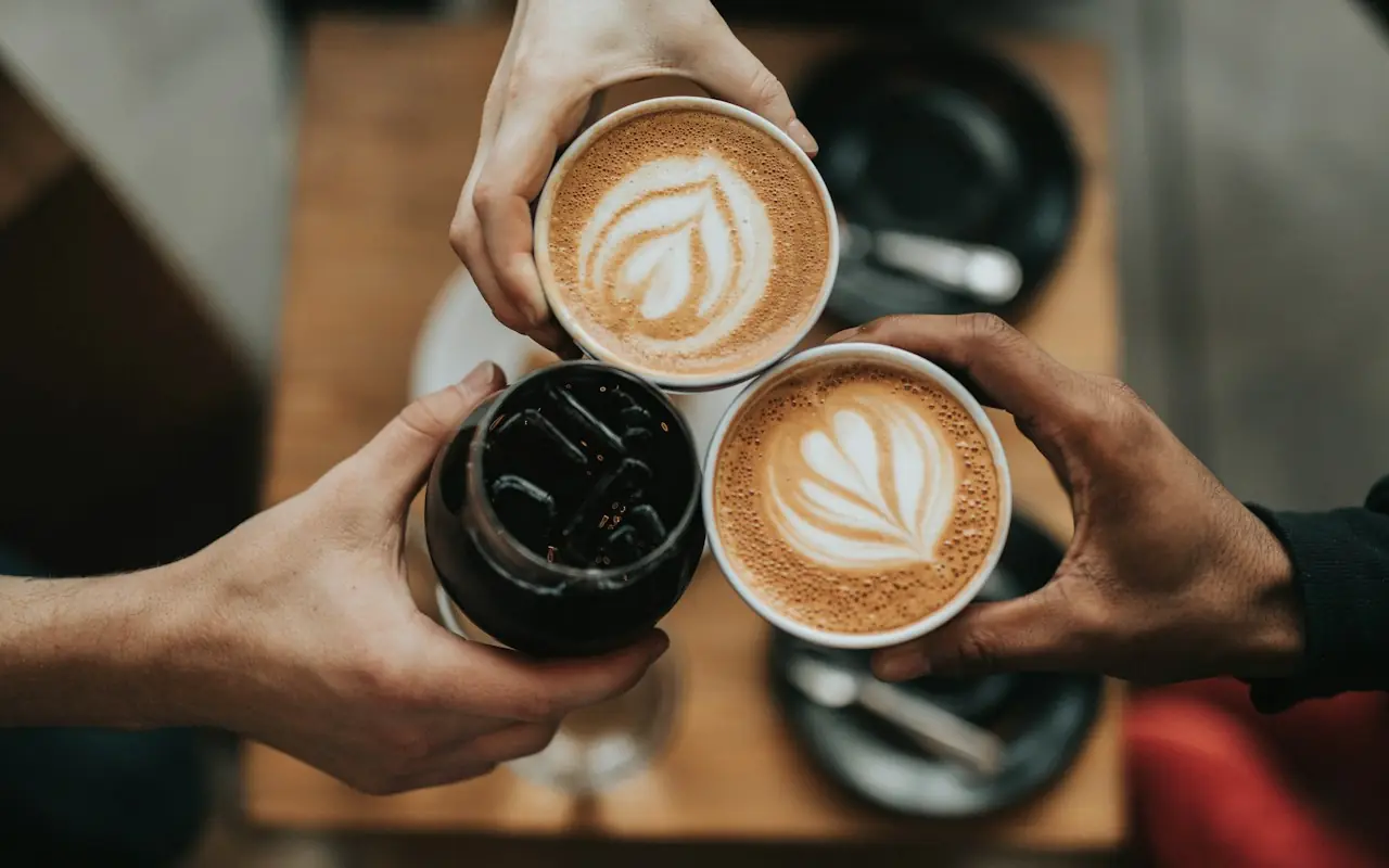 Two cappuccinos on a café table